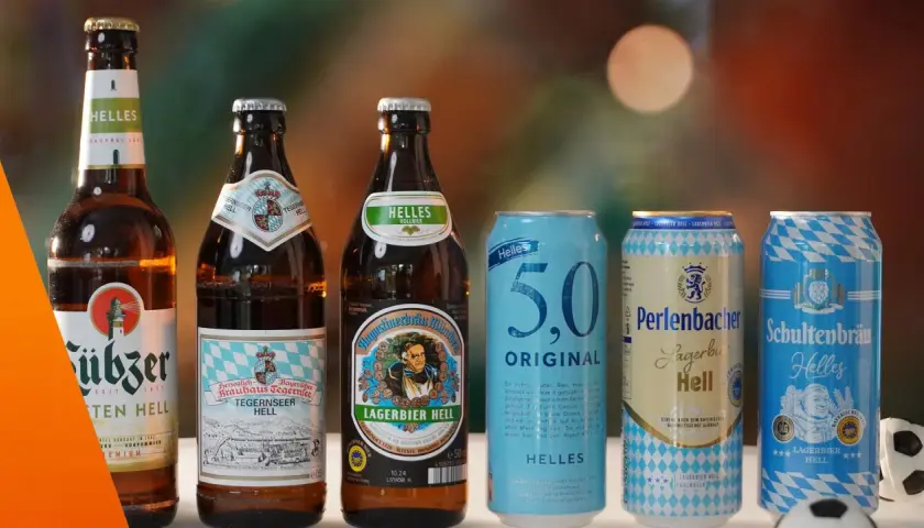 Bekannte biermarken: Flaschen und Dosen von Augustiner, Tegernseer, 5.0, Perlenbacher und Schultenbräu stehen nebeneinander.