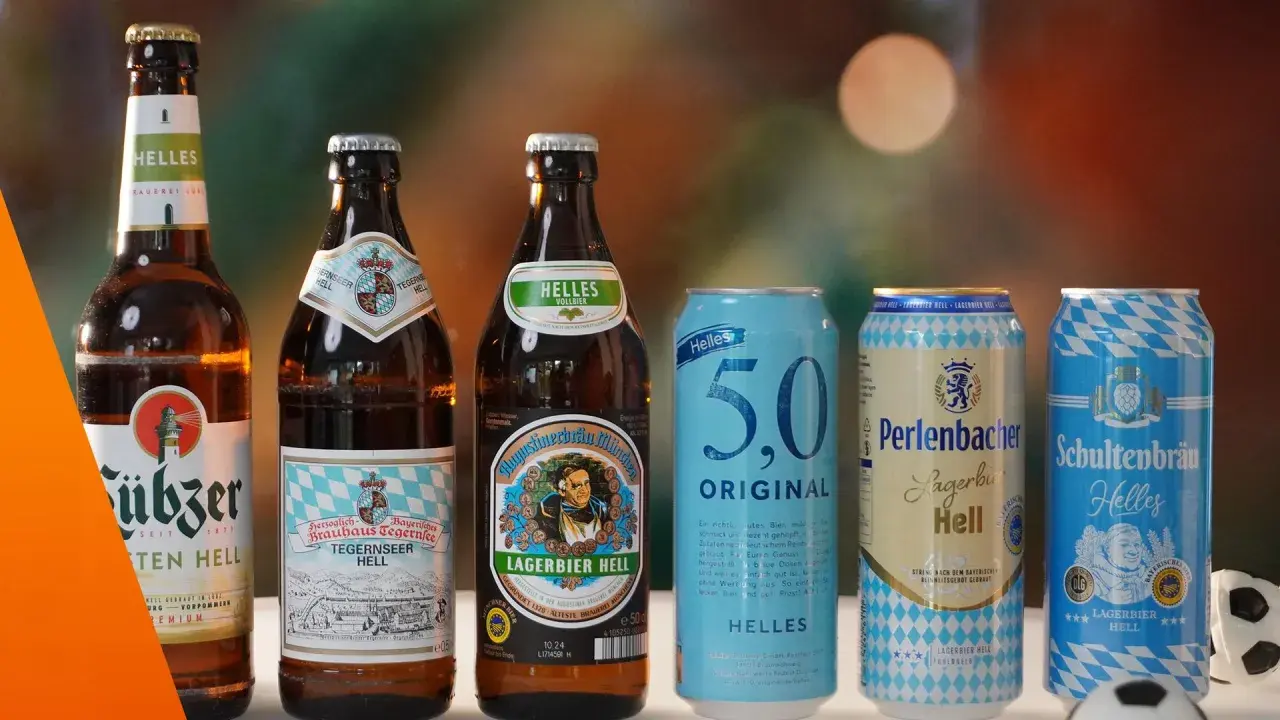 Bekannte biermarken: Flaschen und Dosen von Augustiner, Tegernseer, 5.0, Perlenbacher und Schultenbräu stehen nebeneinander.